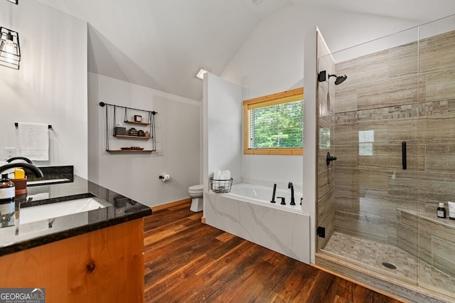 full bathroom with hardwood / wood-style floors, vanity, lofted ceiling, plus walk in shower, and toilet