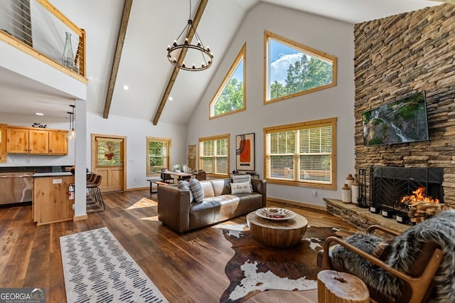 living room featuring dark hardwood / wood-style floors, beam ceiling, a fireplace, and high vaulted ceiling