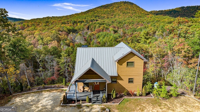 exterior space with covered porch and a mountain view