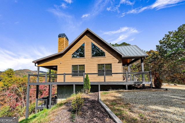 rear view of property with a deck