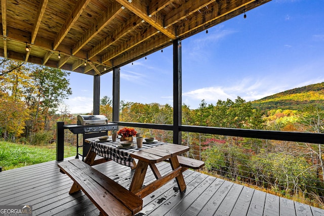 wooden terrace with grilling area