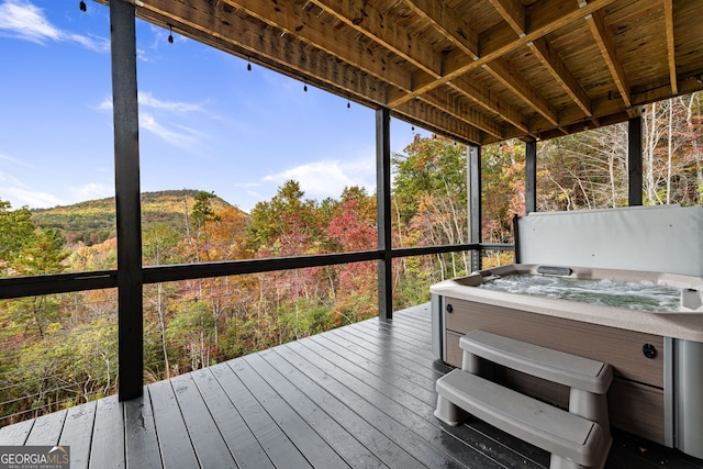 deck featuring a hot tub