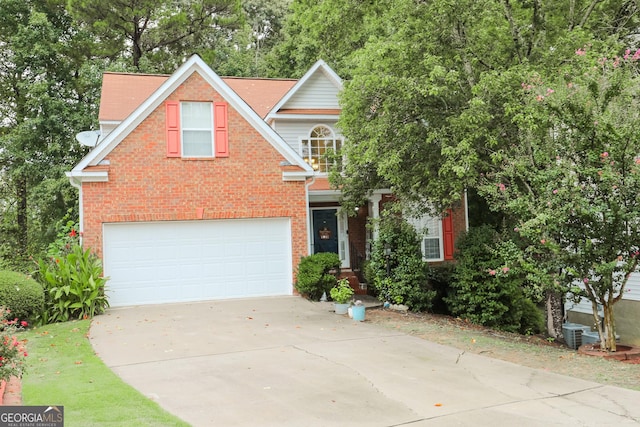 traditional home featuring driveway, a garage, brick siding, and central AC