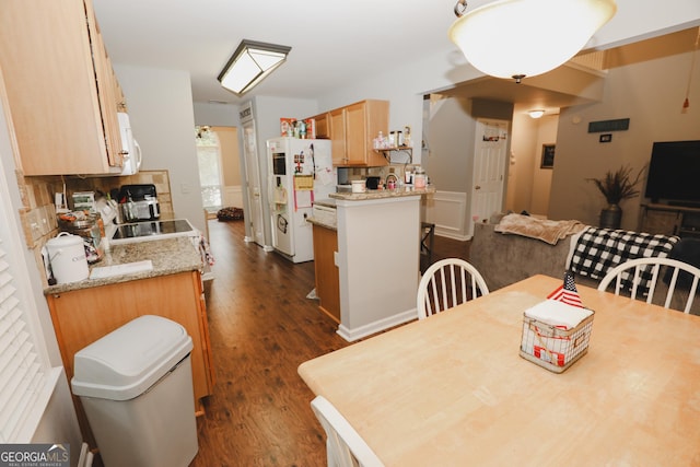 dining space with dark wood-type flooring