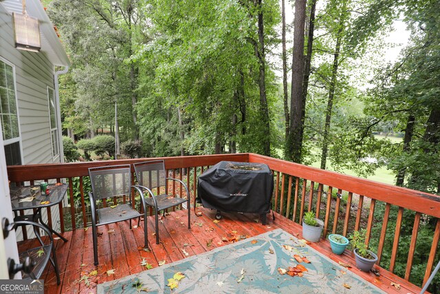 wooden terrace with grilling area