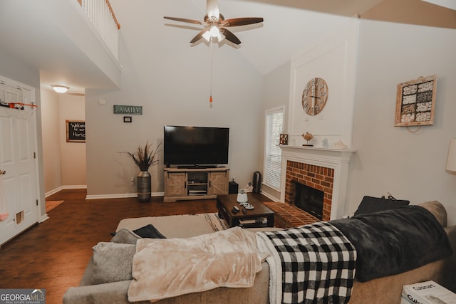 living room featuring dark hardwood / wood-style flooring, a brick fireplace, high vaulted ceiling, and ceiling fan