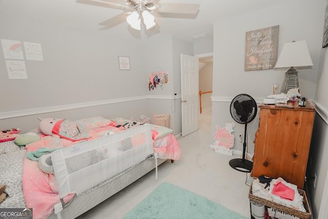 carpeted bedroom with visible vents and a ceiling fan