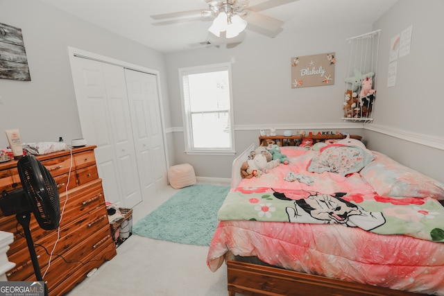 bedroom with ceiling fan, a closet, and carpet floors