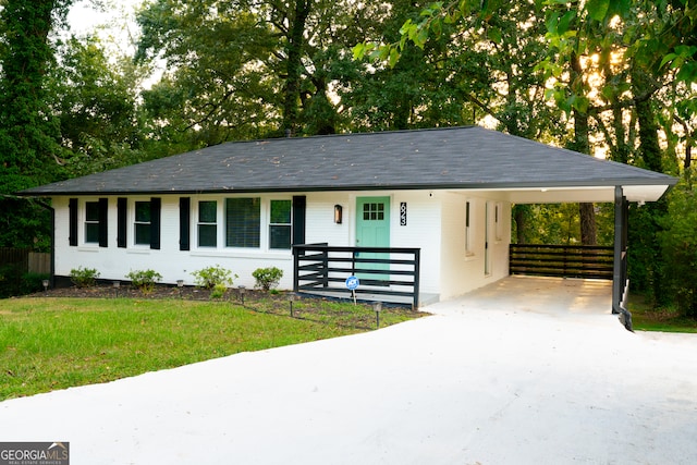 ranch-style house with a carport