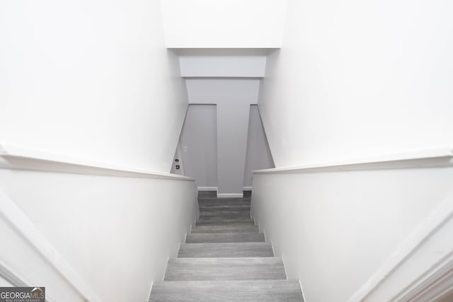 stairway featuring hardwood / wood-style floors