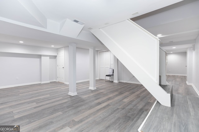 basement featuring wood-type flooring