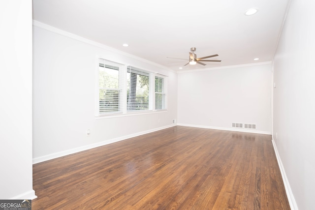 unfurnished room with ornamental molding, dark hardwood / wood-style floors, and ceiling fan