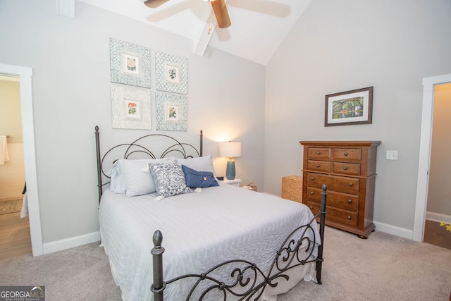 carpeted bedroom featuring high vaulted ceiling and ceiling fan