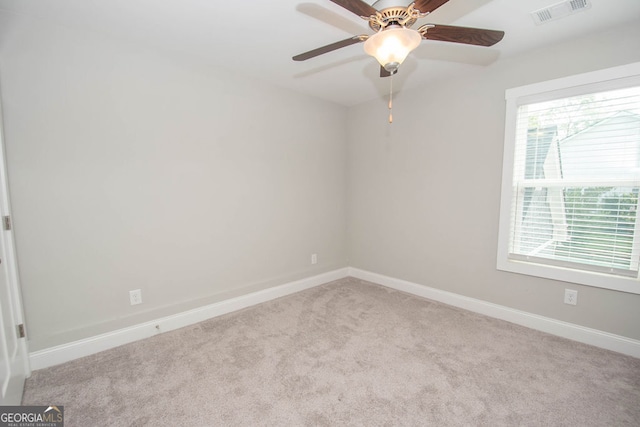 carpeted empty room with ceiling fan