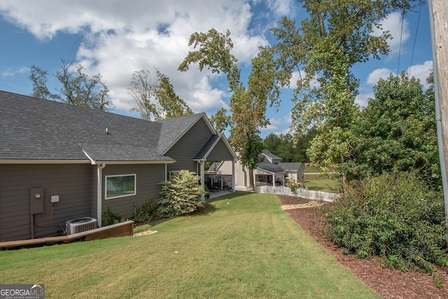 view of yard with central AC