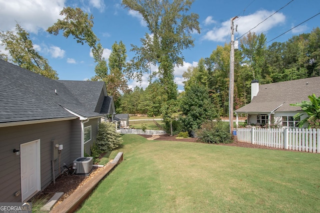 view of yard with central air condition unit