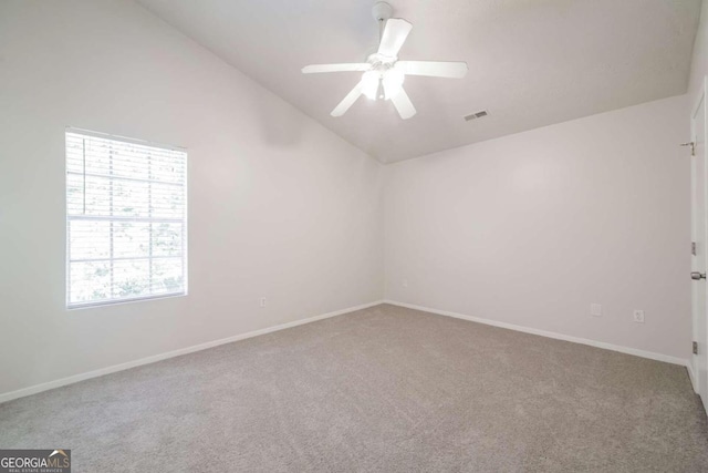 unfurnished room featuring visible vents, carpet flooring, a ceiling fan, and baseboards