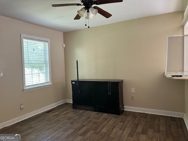 interior space with dark hardwood / wood-style floors and ceiling fan