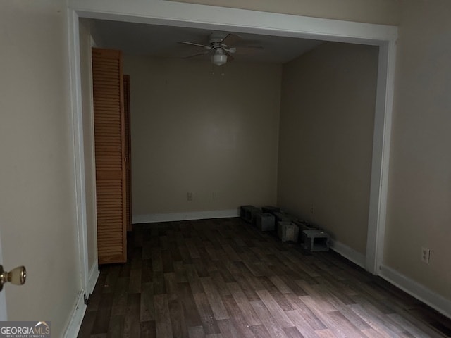 spare room featuring ceiling fan and dark hardwood / wood-style flooring