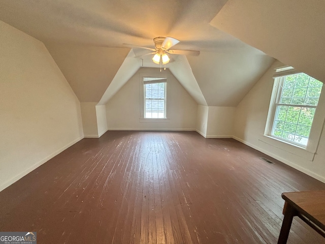 bonus room featuring dark wood-type flooring, lofted ceiling, and ceiling fan