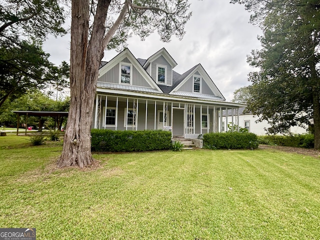 view of front of house with a front yard and a porch