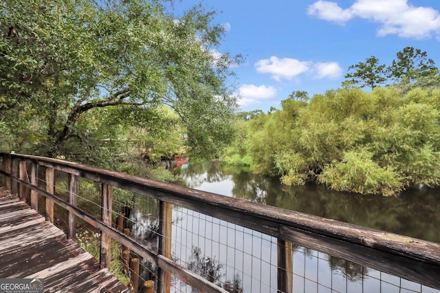 deck featuring a water view