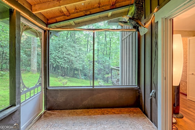 unfurnished sunroom with vaulted ceiling