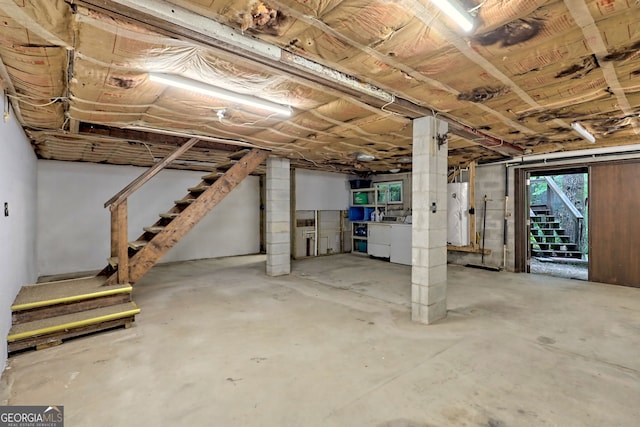 basement with washing machine and clothes dryer