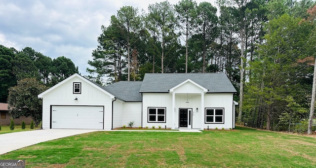 modern farmhouse style home featuring a garage and a front lawn