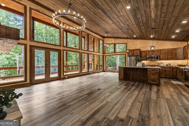 sunroom featuring a chandelier, french doors, wooden ceiling, and lofted ceiling