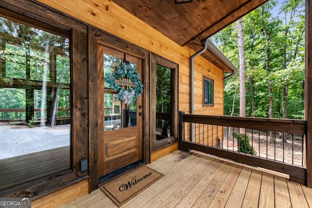 wooden deck featuring covered porch