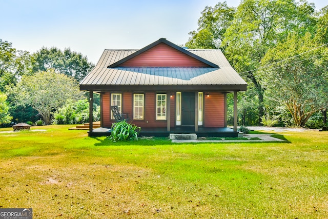 view of front facade with a front yard and a porch