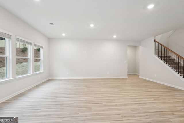 unfurnished living room featuring light wood-type flooring