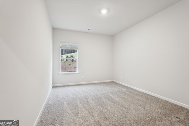 unfurnished room with carpet flooring