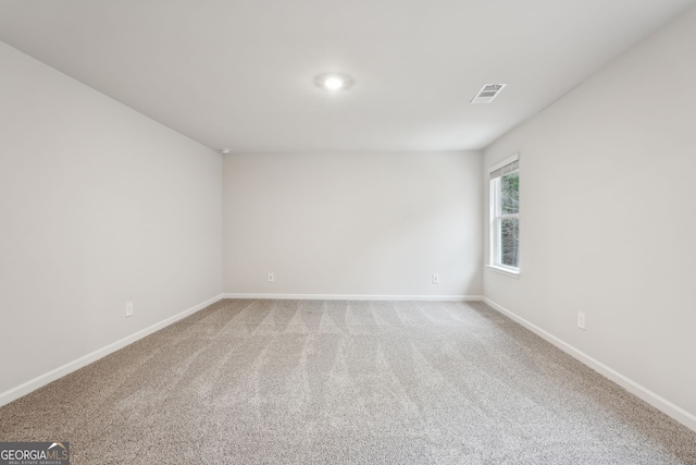 spare room with carpet floors