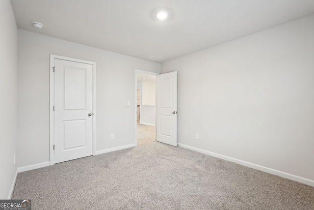 unfurnished bedroom featuring carpet