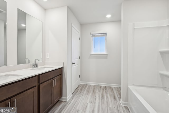 bathroom with vanity and hardwood / wood-style flooring