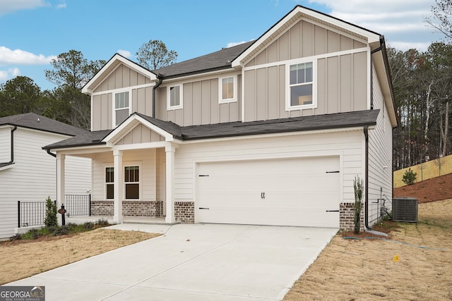 craftsman-style house with central air condition unit and a garage