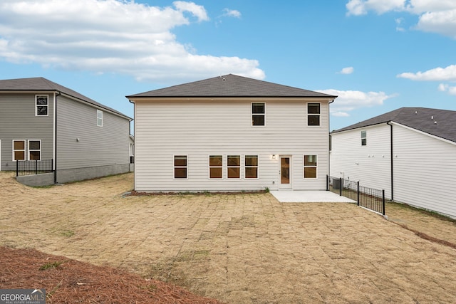 rear view of house with a patio