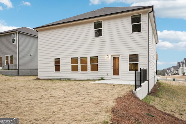 back of property with a patio area