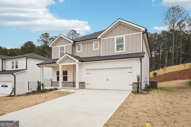 view of front of house featuring central AC unit and a garage