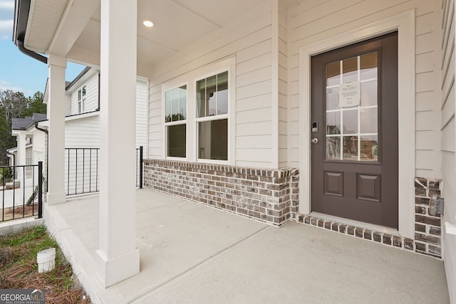 doorway to property with a porch