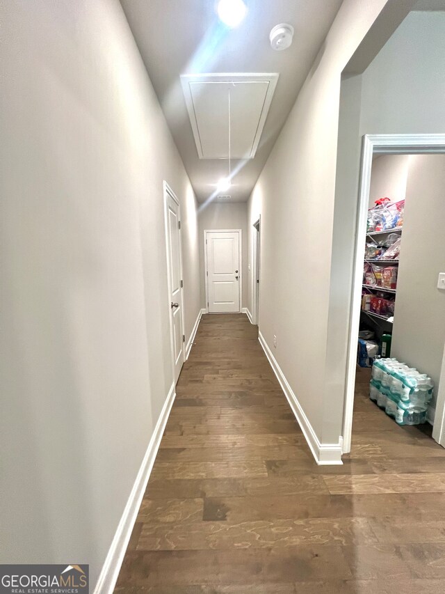 hall with dark wood-type flooring