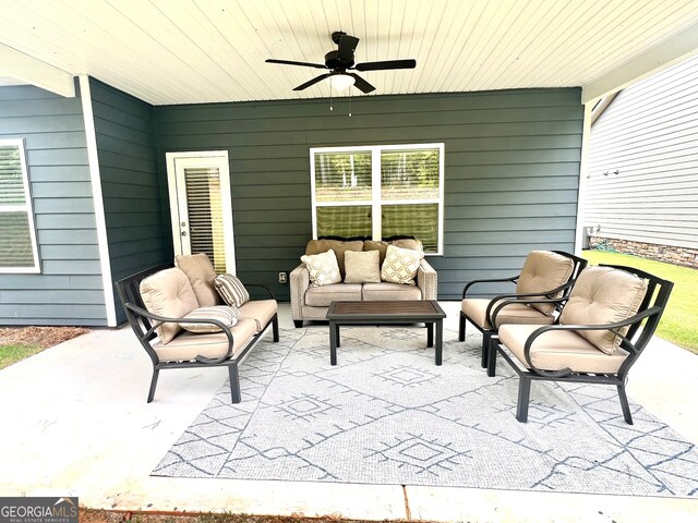 view of patio featuring an outdoor living space and ceiling fan