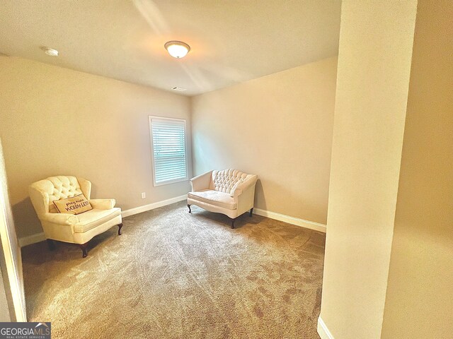 unfurnished room featuring carpet