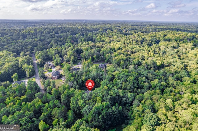 aerial view featuring a wooded view