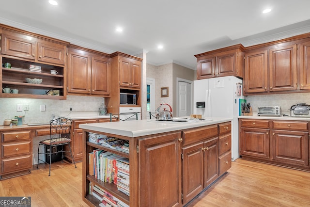 kitchen with light wood-style floors, light countertops, open shelves, and a kitchen island
