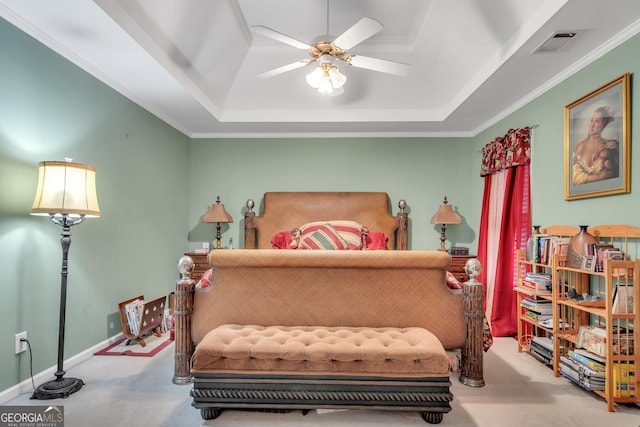 bedroom featuring carpet flooring, visible vents, and a raised ceiling