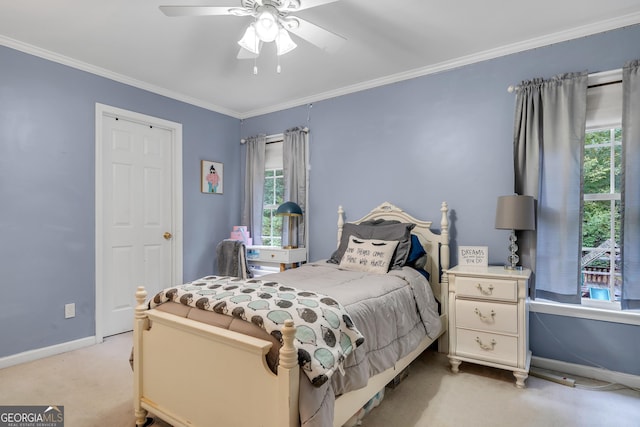 bedroom with baseboards, multiple windows, light colored carpet, and crown molding