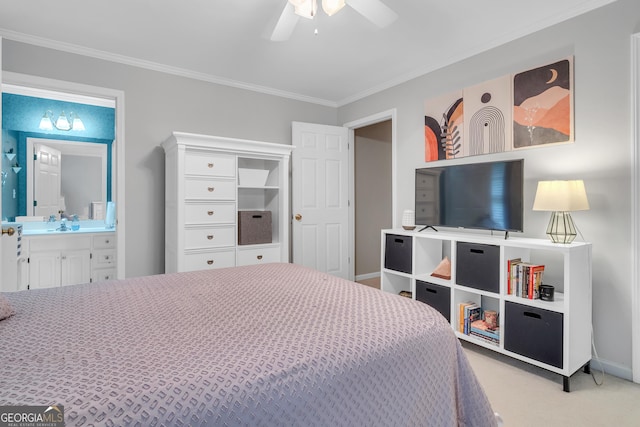 carpeted bedroom with ensuite bath, baseboards, crown molding, and ceiling fan
